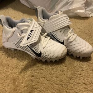 White Nike Alpha cleats